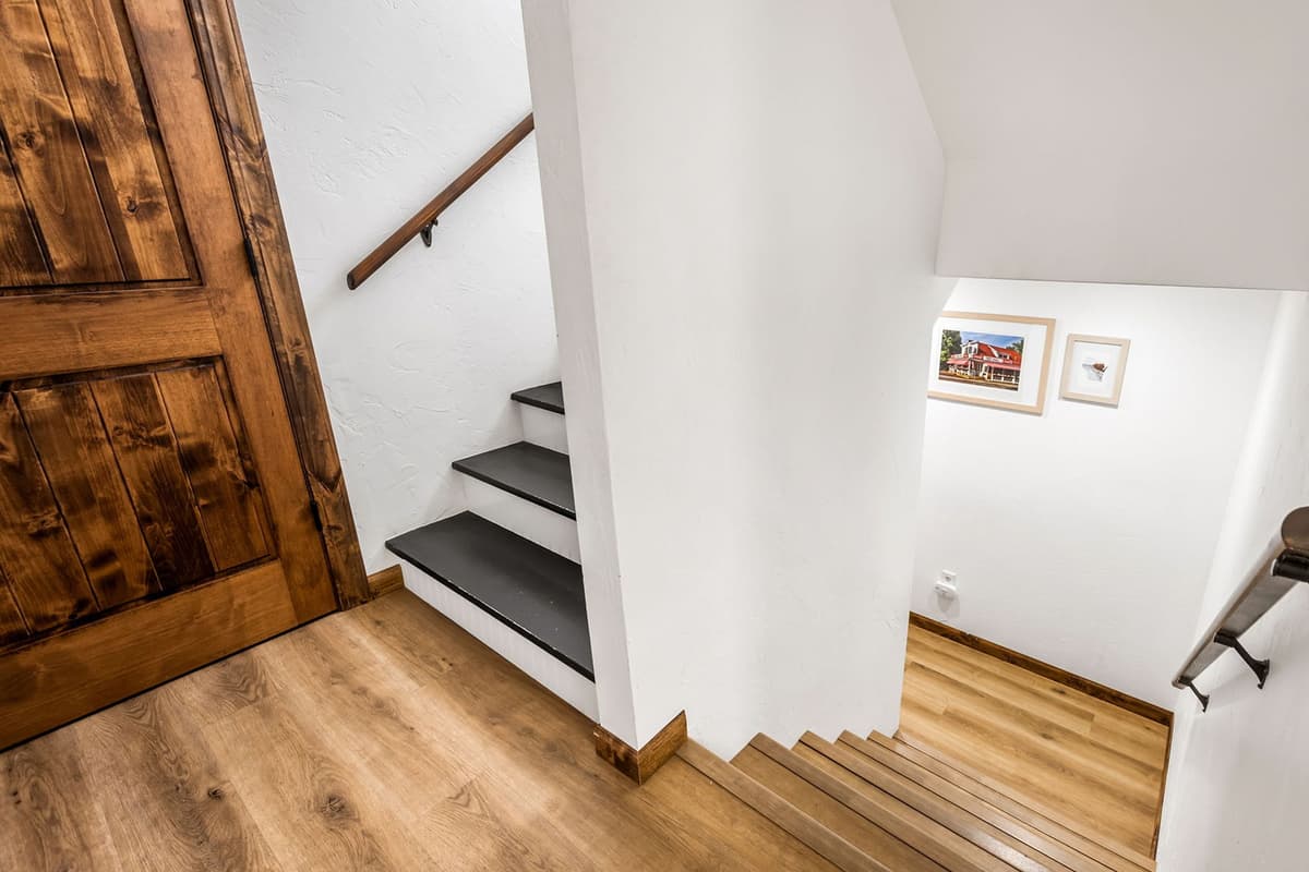 The staircase provides easy access between the main level and the upper floor.