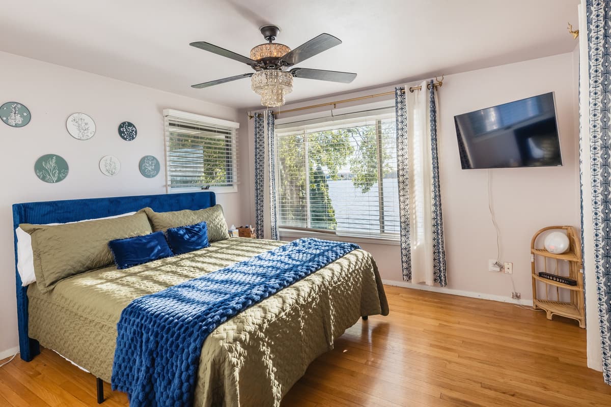 The upstairs king bedroom offers a comfortable and inviting space to unwind after a day by the lake.
