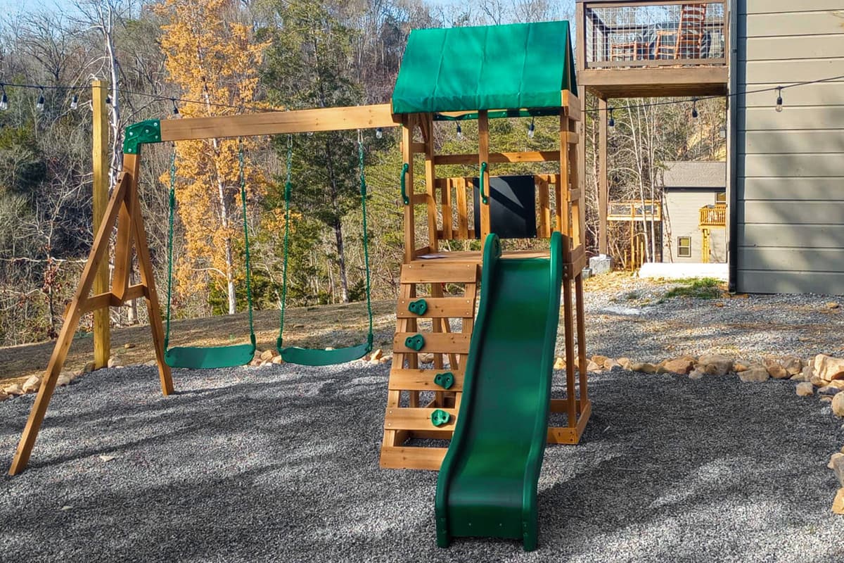 The outdoor playground features a fun swing and slide, giving kids a chance to run, climb, swing, and let their imaginations take over. It’s the perfect spot for some fresh-air fun while parents relax nearby.