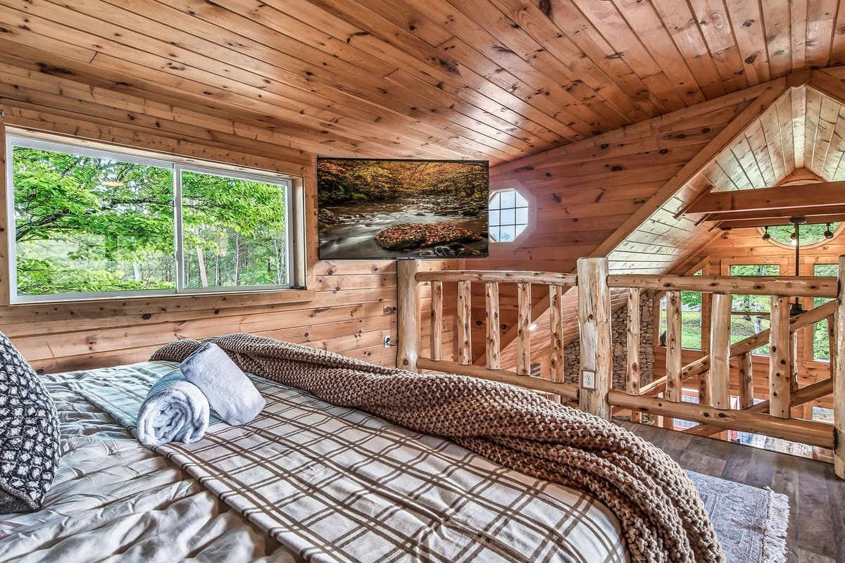 The spacious bed offers a peaceful place to relax and recharge after a day of Smoky Mountain adventures.