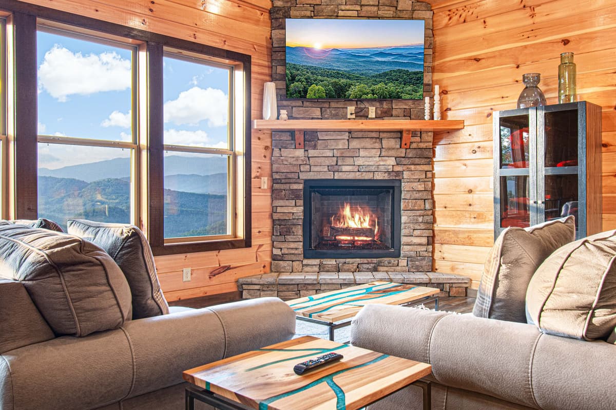 Curl up on the sofa and enjoy a movie while the fireplace creates a cozy ambiance.