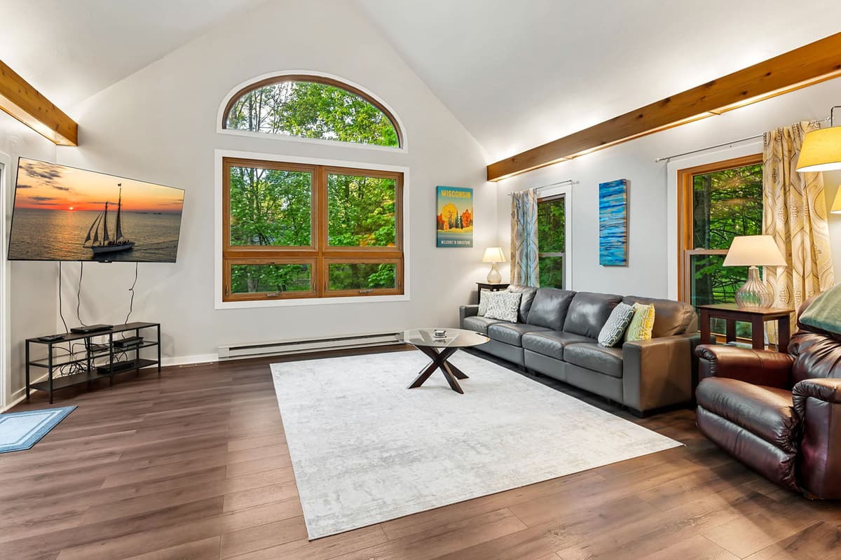 Settle into the bright and inviting sunroom, designed for relaxing at any time of day.
