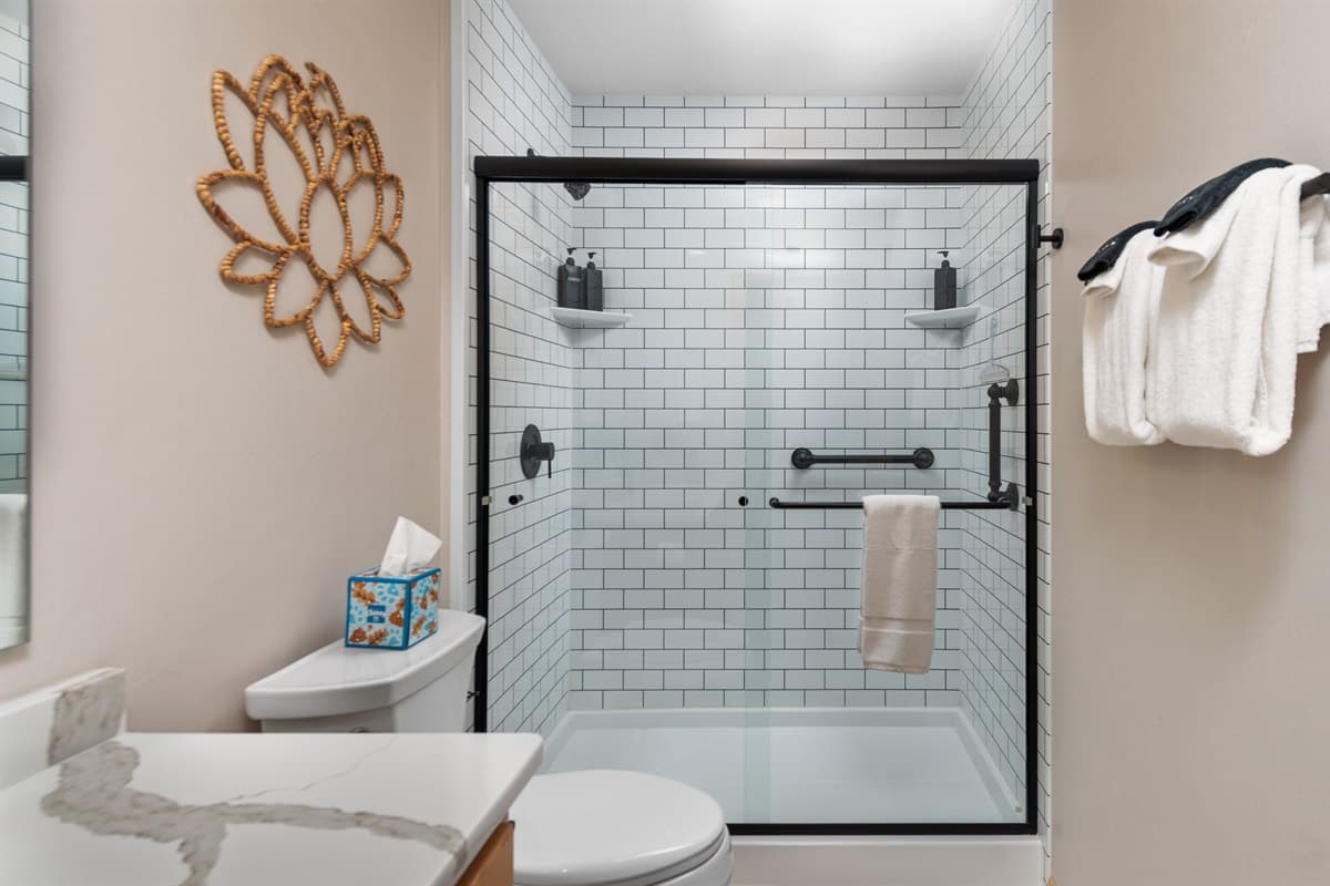 The clean, contemporary design is complemented by high-quality fixtures and soft lighting.