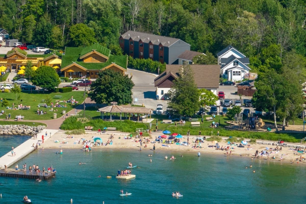 Enjoy a day of sun and fun at Sister Bay Beach, where soft sands and sparkling waters provide the perfect backdrop for relaxation and adventure in Door County!