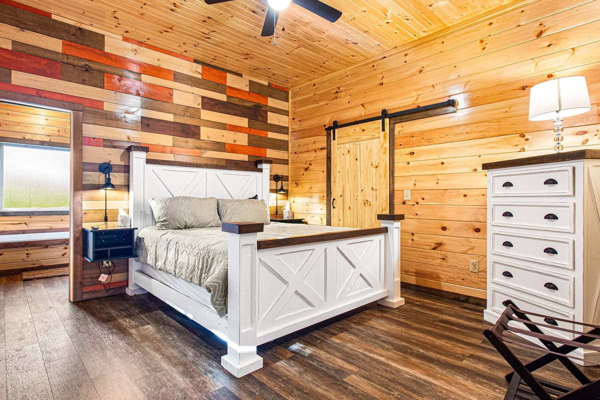 The main-level king bedroom offers a comfortable and peaceful retreat after a day of exploring the Smokies.
