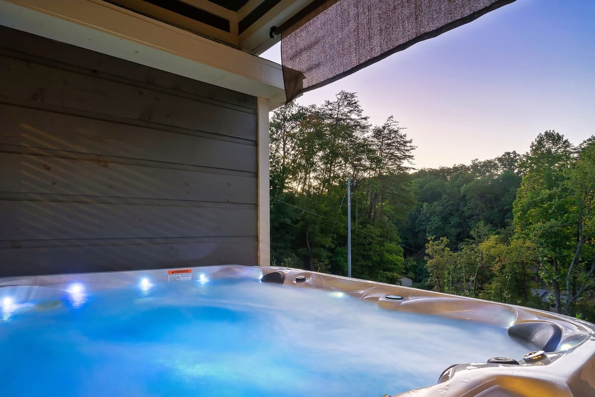 Unwind in the bubbling hot tub while surrounded by the peaceful beauty of the Smoky Mountains.
