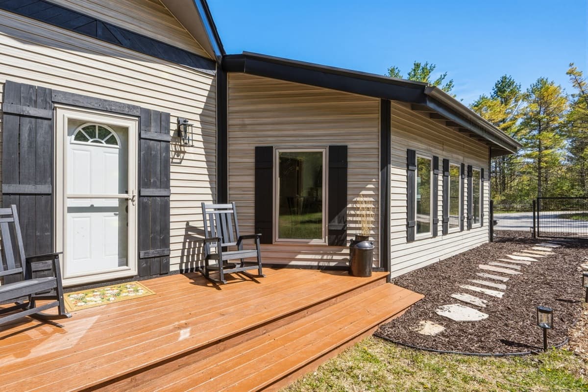 Deck with comfortable rocking chairs, perfect for relaxing and enjoying the peaceful Door County surroundings. 