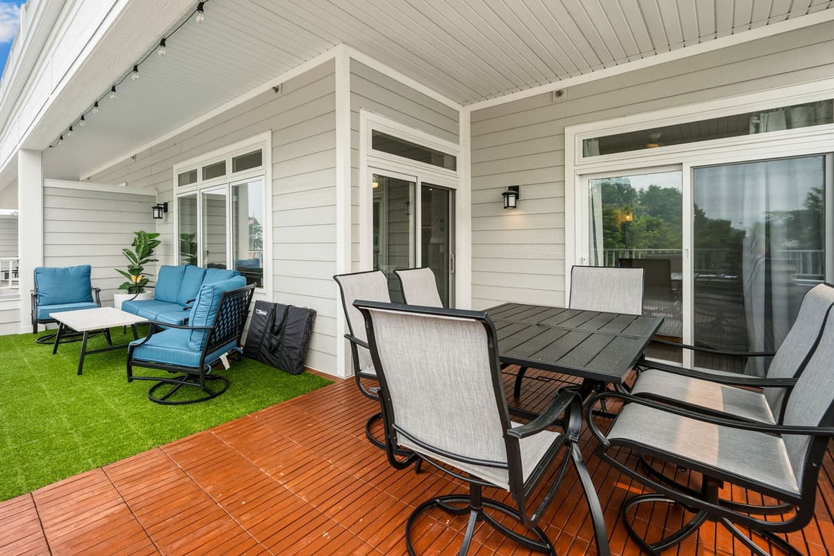 Step outside onto the spacious deck featuring a comfortable outdoor living area with plenty of seating.