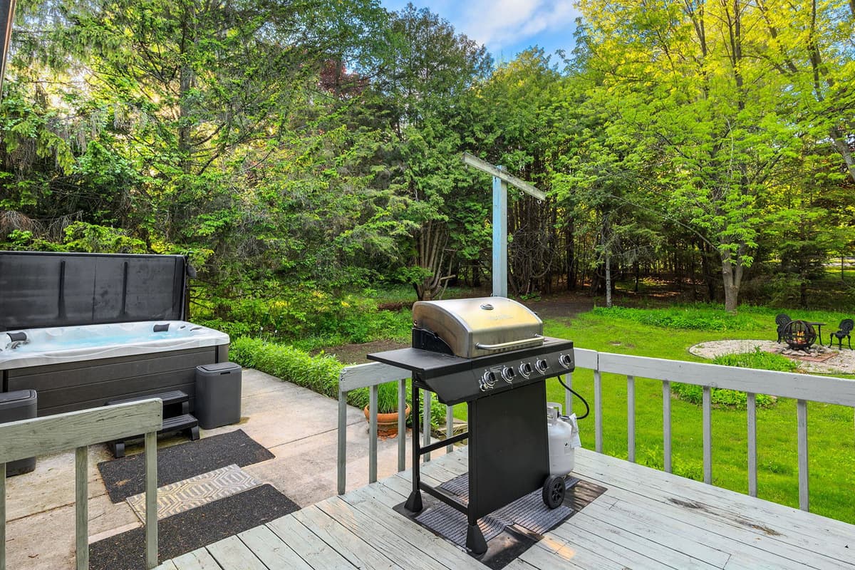 Step outside to your private patio, where you can unwind in the hot tub or fire up the propane grill for an easy outdoor meal.