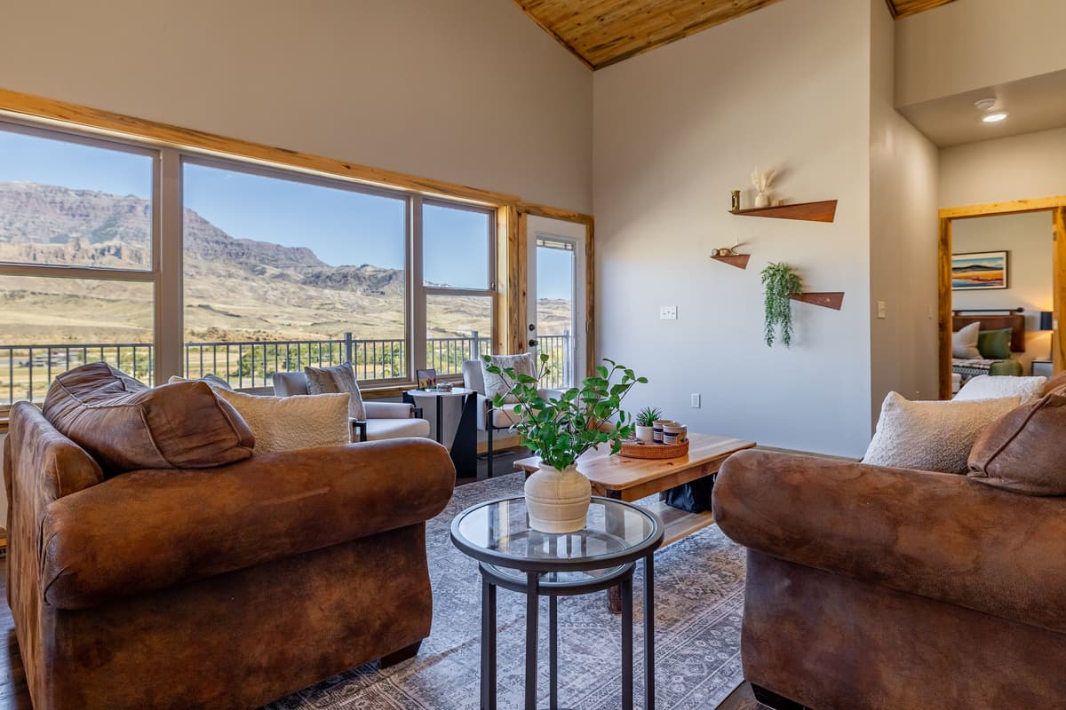 Natural light fills the space, creating a warm and inviting atmosphere throughout the day. Settle into the comfortable seating and take in the panoramic views without ever leaving the cabin.