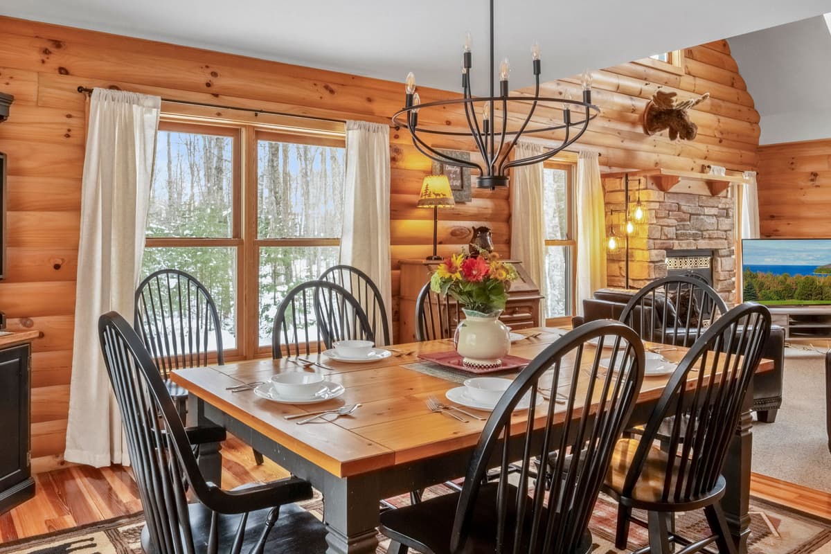 Enjoy meals together in the inviting dining area, surrounded by large windows that fill the space with natural light.