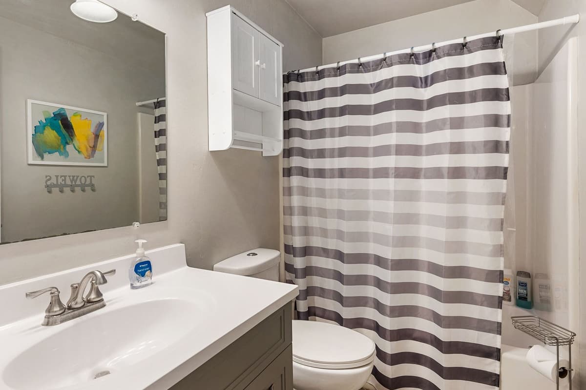 A clean and convenient full bathroom, perfect for freshening up after a day of adventure.