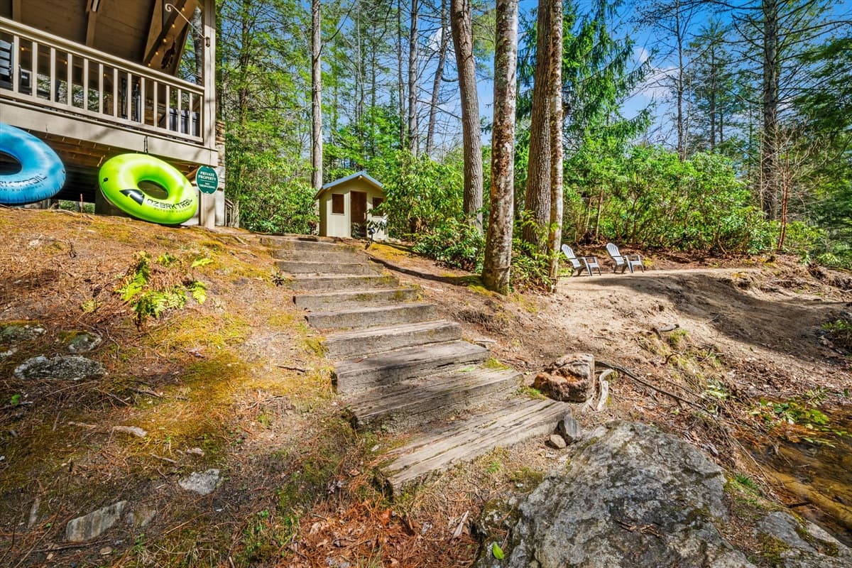 Stroll down to the river and unwind - tubes are conveniently stored under the crawlspace for a fun float!