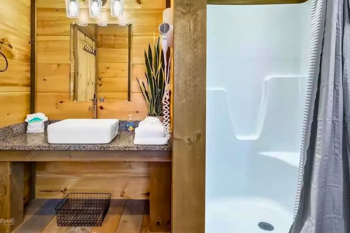 Refresh and recharge in the full bathroom, featuring a spacious walk-in shower for a comfortable and convenient stay.