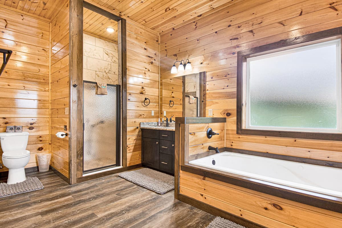 The spacious ensuite bathroom features a separate walk-in shower and soaking tub, offering the perfect combination of convenience and relaxation
