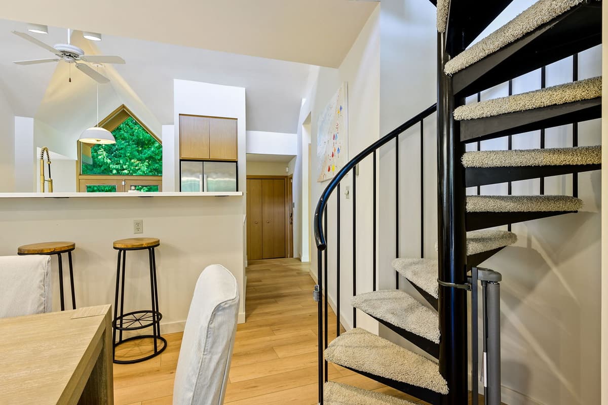 Head upstairs to discover a dedicated work area and cozy secondary living space.