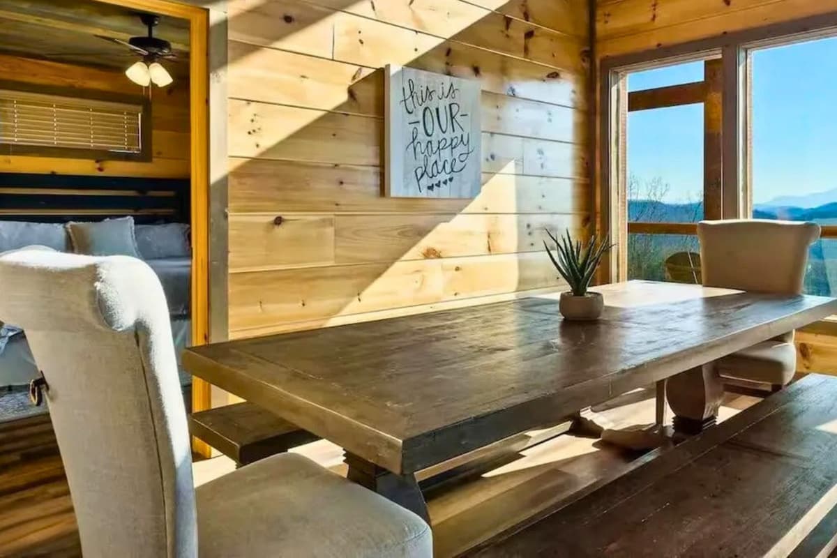 Adjacent to the living area, the dining space offers a comfortable spot to gather for meals, morning coffee, and conversations
