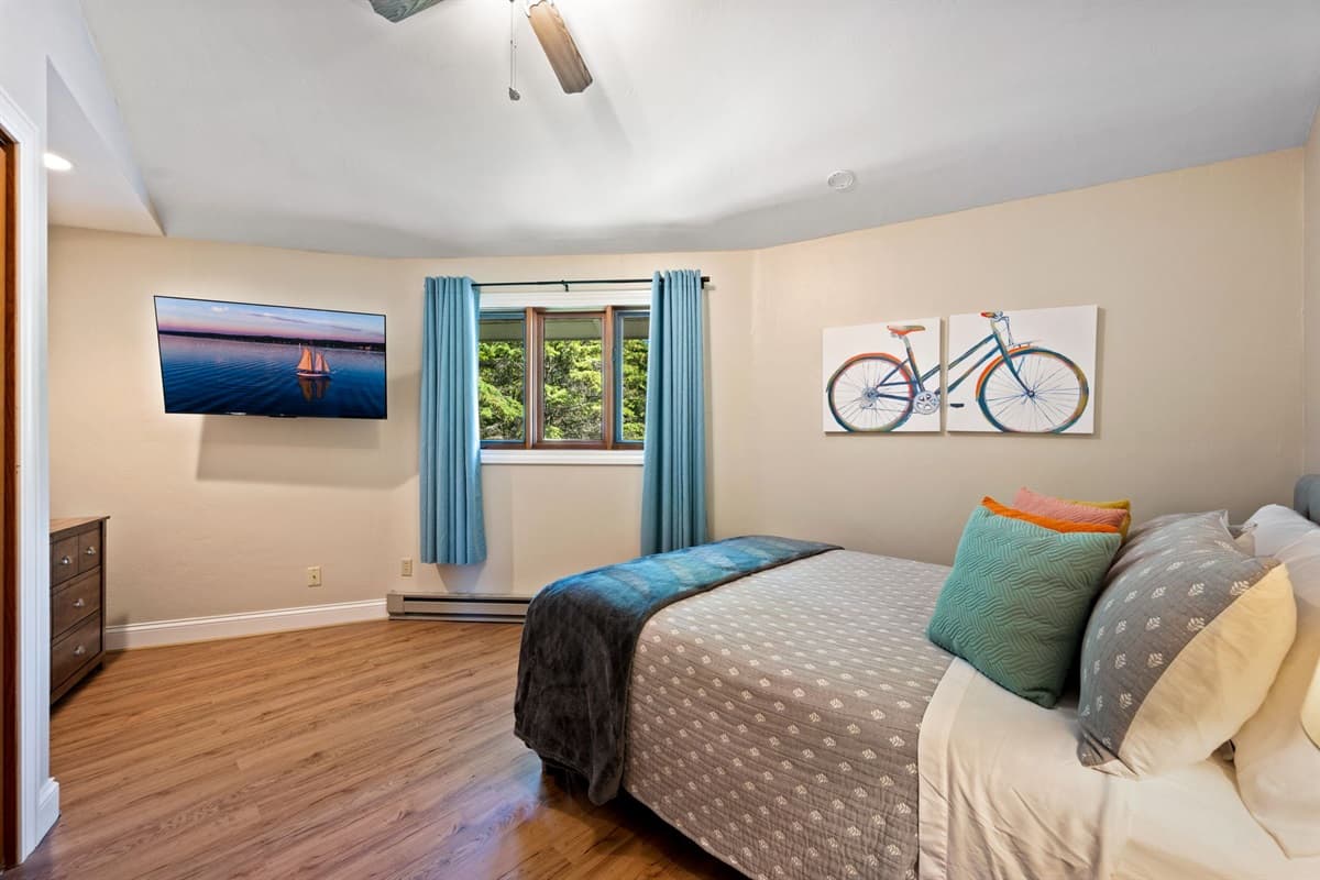 Indulge in a restful night's sleep in our charming and comfortable bedroom.