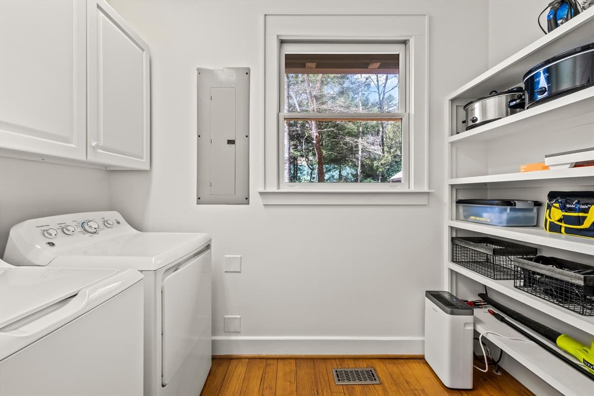 Laundry Room with Full-Size Washer and Dryer, Storage Shelves and Cleaning Supplies