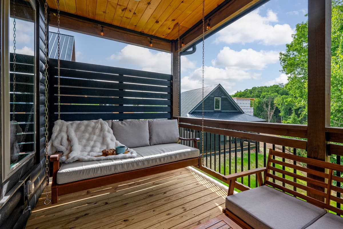 Slow down and enjoy the simple pleasures of cabin life from the comfort of the porch swing.