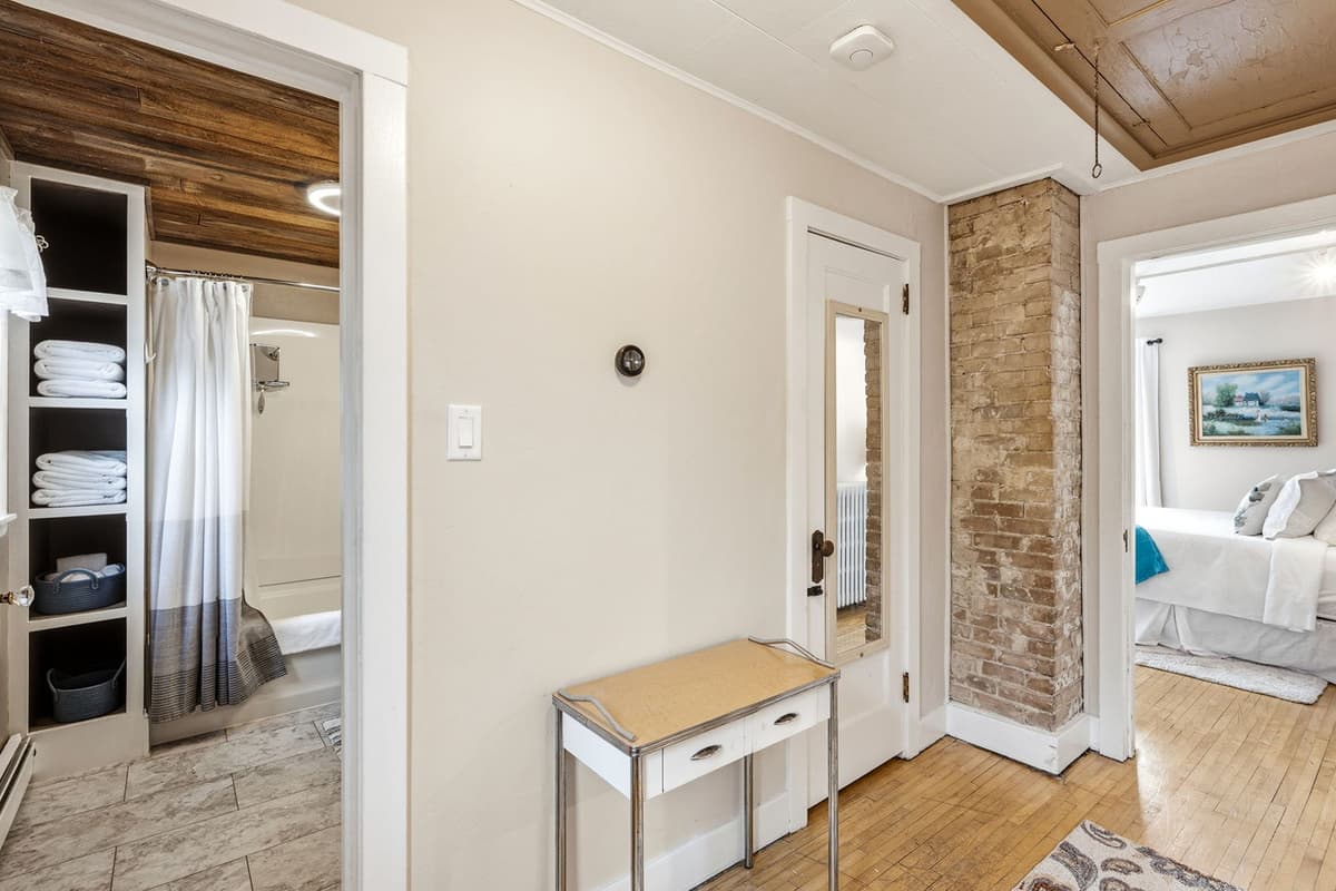 Clean, comfortable, and conveniently located near the upstairs bedrooms, it’s a practical space for getting ready and winding down after a day of exploring.