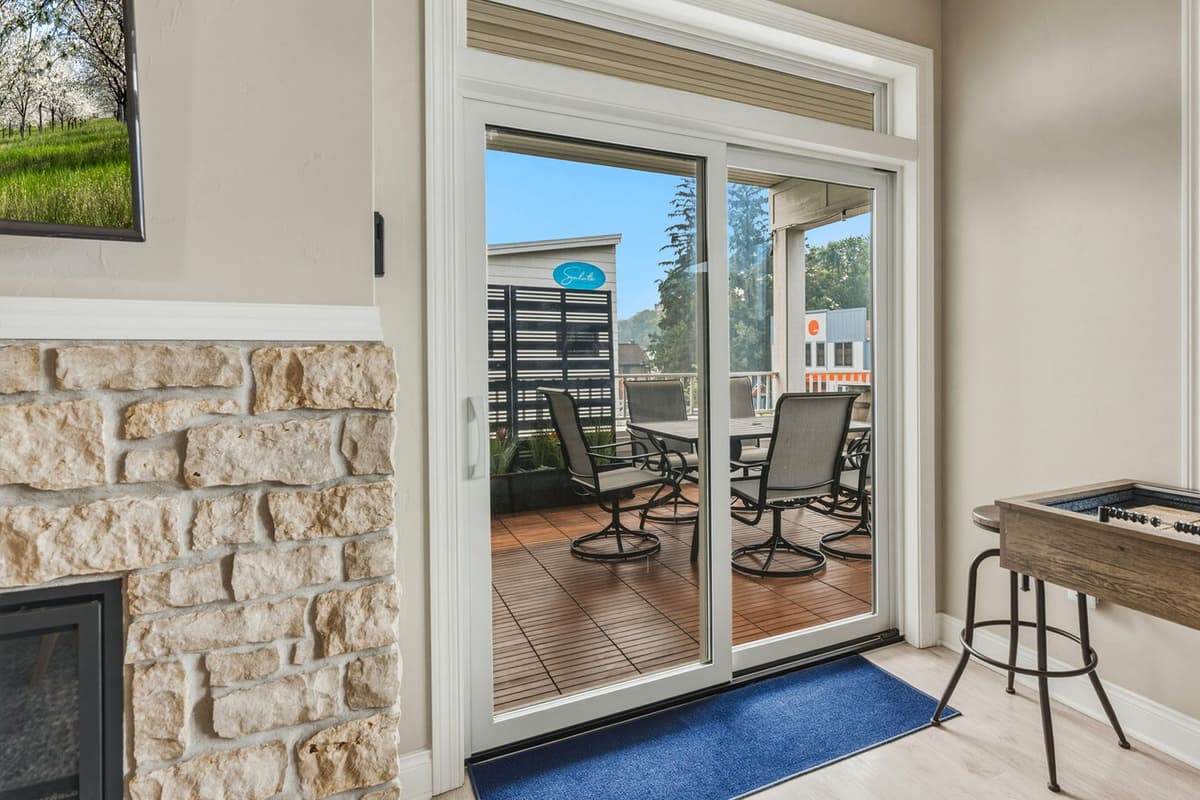 The glass doors bring in plenty of natural light and create an easy connection between the indoors and outdoors.