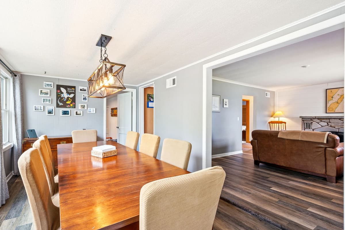 The spacious dining area offers comfortable seating for up to 8 guests, making it ideal for shared meals and gatherings.