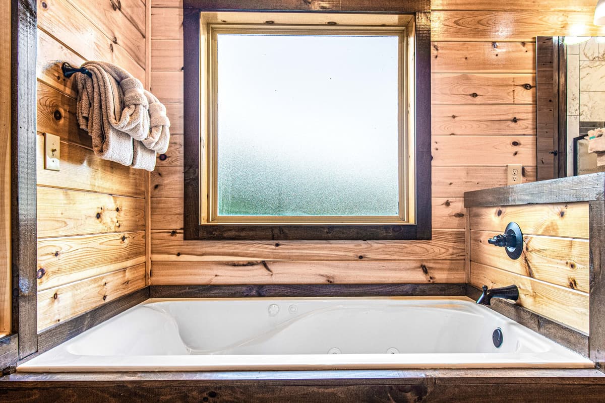 Unwind in the inviting soaking bathtub, the perfect place to relax and recharge after a day of exploring the Smokies.