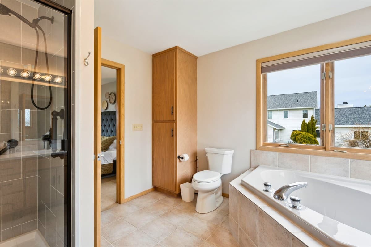 The master suite's ensuite bathroom offers the perfect blend of relaxation and convenience.