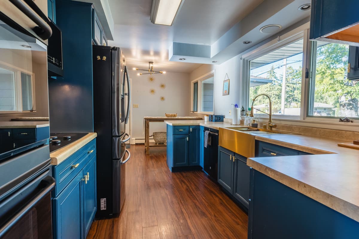 The spacious kitchen is fully stocked with everything you need to prepare meals during your stay. Stainless steel appliances give the kitchen a clean and modern look.