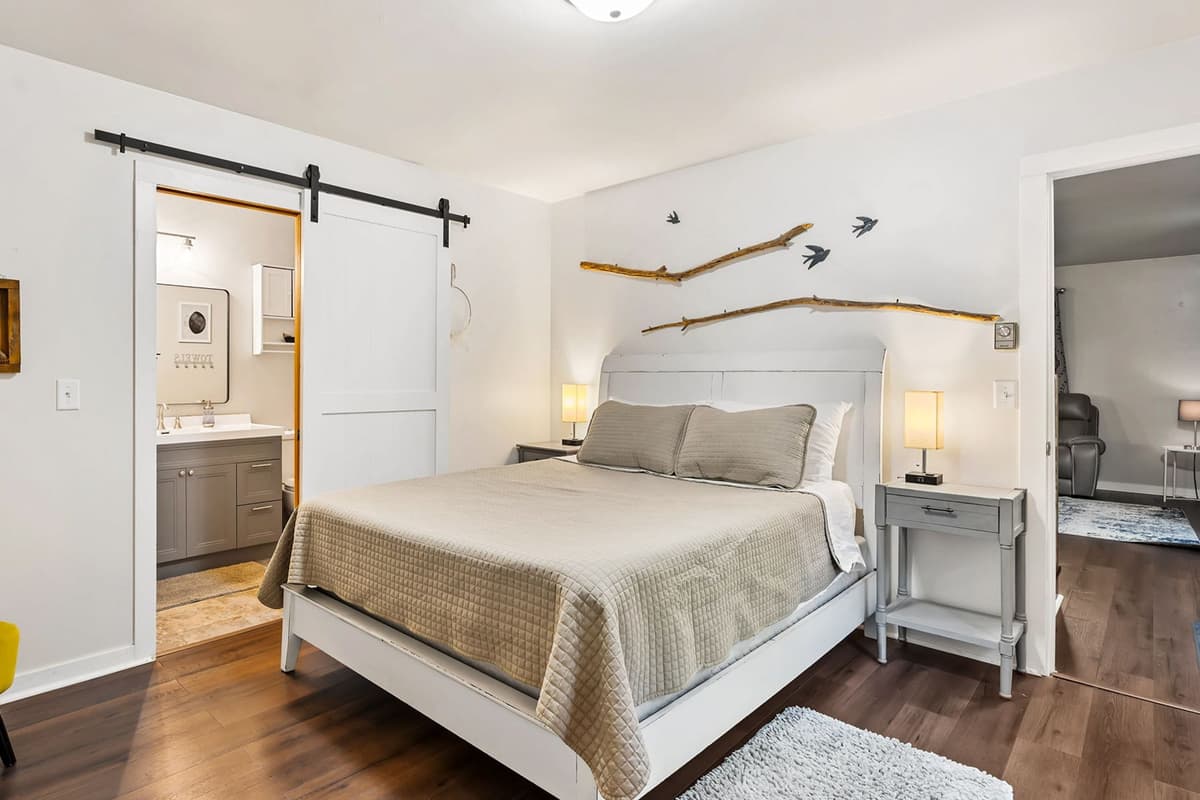 Rest easy in another inviting queen bedroom, featuring a comfortable queen-size bed and a peaceful setting for a good night’s sleep.