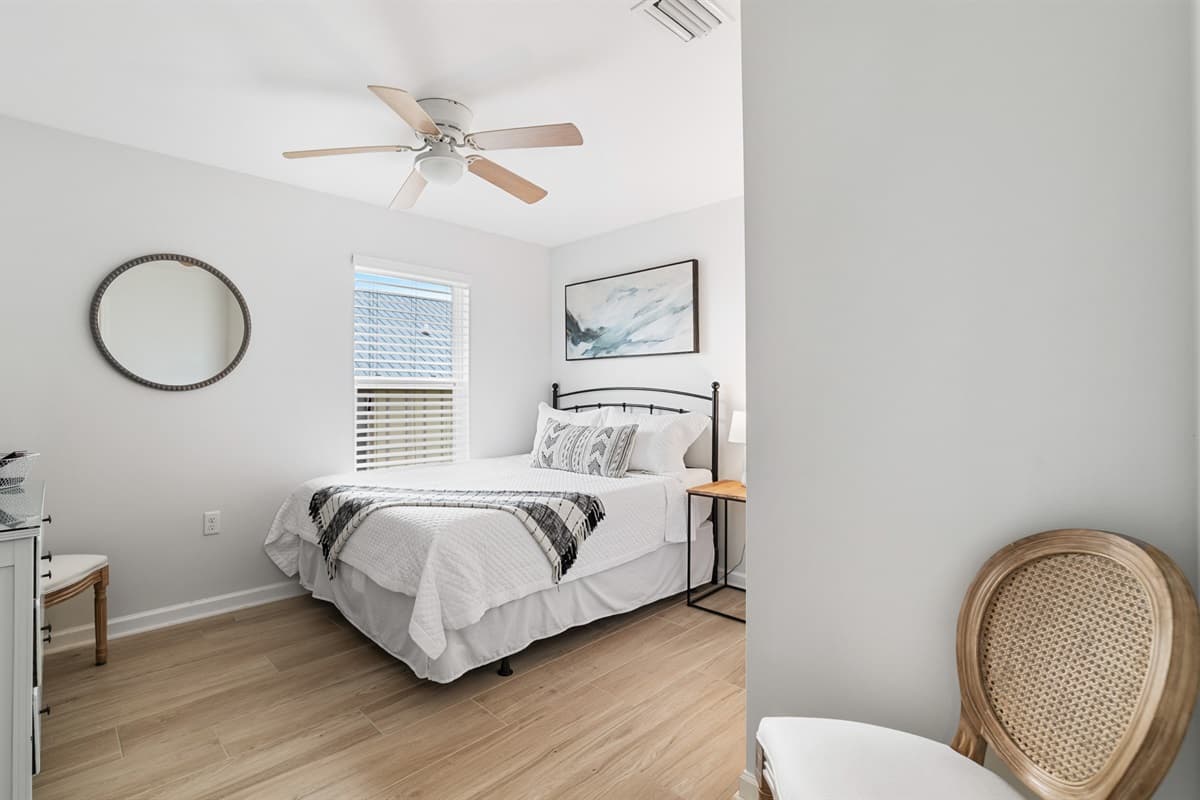 Step into the inviting queen-size bedroom, where comfort meets charm.
