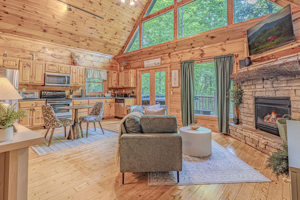 he open-concept living, dining, and kitchen area makes it easy to cook, share a meal, relax by the fireplace, and keep the conversation going.