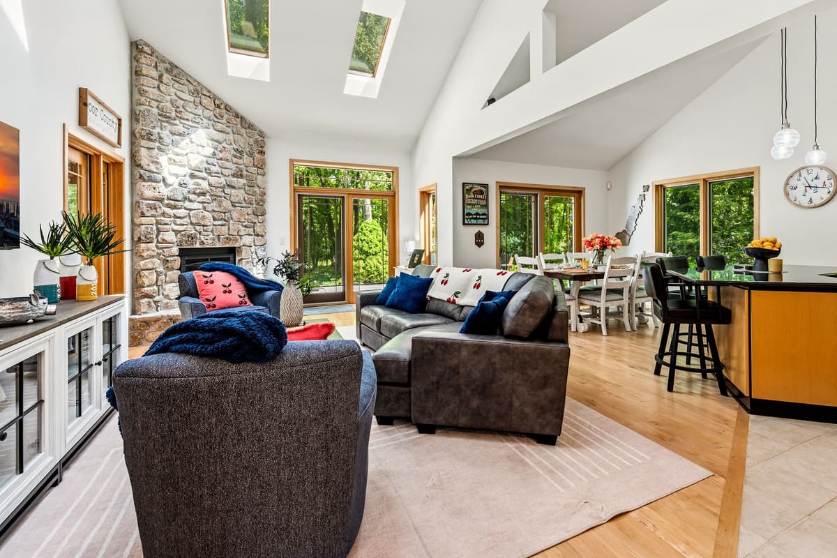 Enjoy a bright, open-concept space with a beautiful vaulted ceiling, bringing the living, dining, and kitchen areas together for a spacious and welcoming atmosphere.