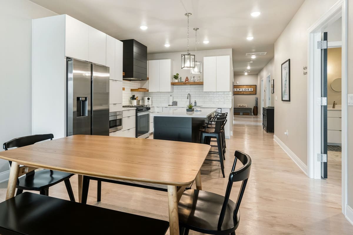 Spacious dining area with seating for up to 6 guests, offering a comfortable spot to gather and enjoy meals together.