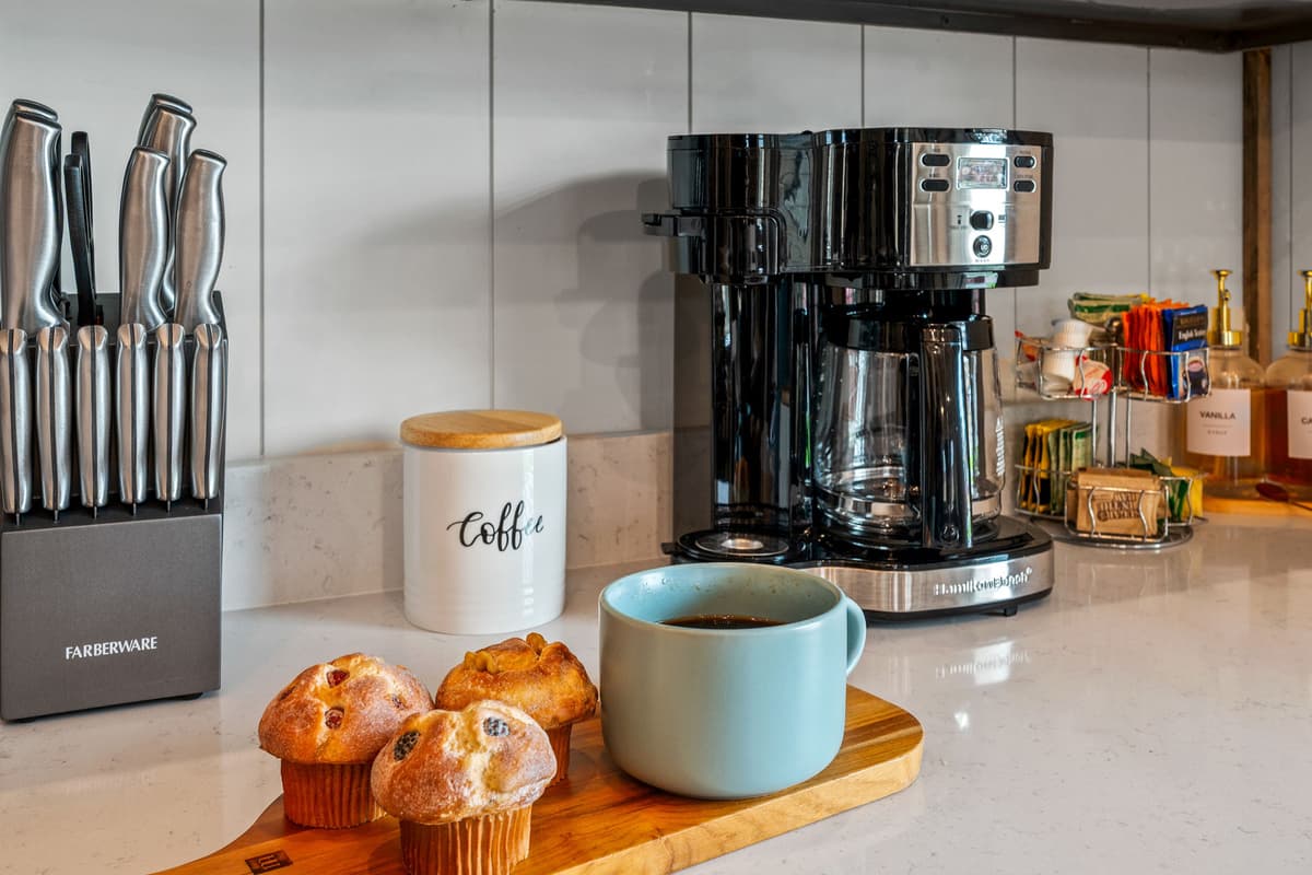 The cabin’s coffee station offers both a traditional brew option and convenient K-Cups, making it easy for everyone to enjoy their favorite way to start the day.