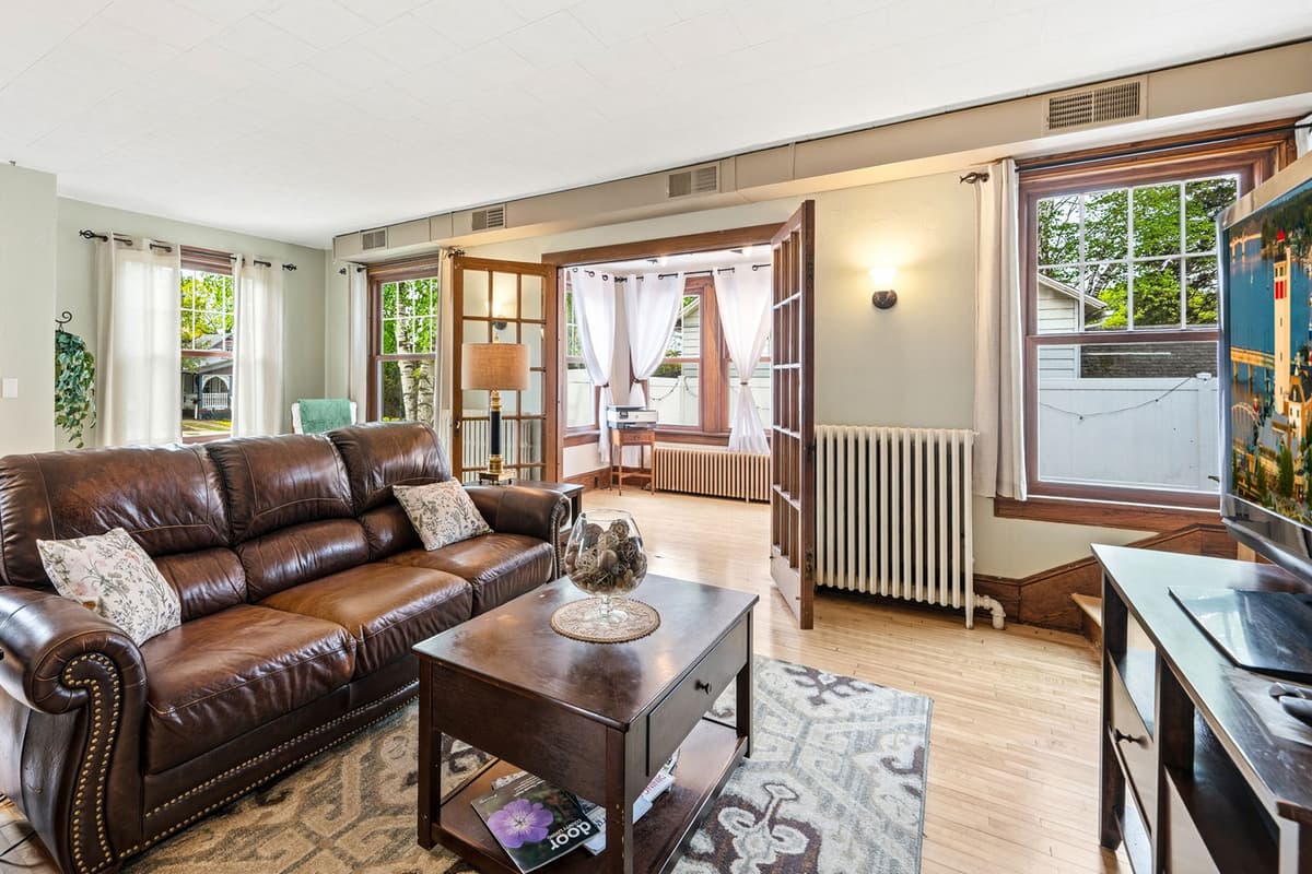 Thoughtful décor adds warmth and character while keeping the room feeling bright and welcoming. Whether you're enjoying a quiet evening or gathering with loved ones, this living area is a comfortable place to relax and connect.