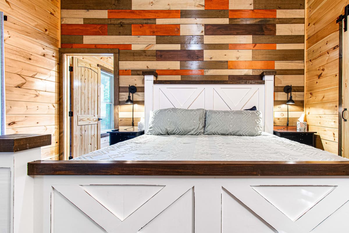 Featuring a spacious king-size bed, cozy furnishings, and thoughtful touches, this inviting bedroom is designed for a restful night’s sleep.