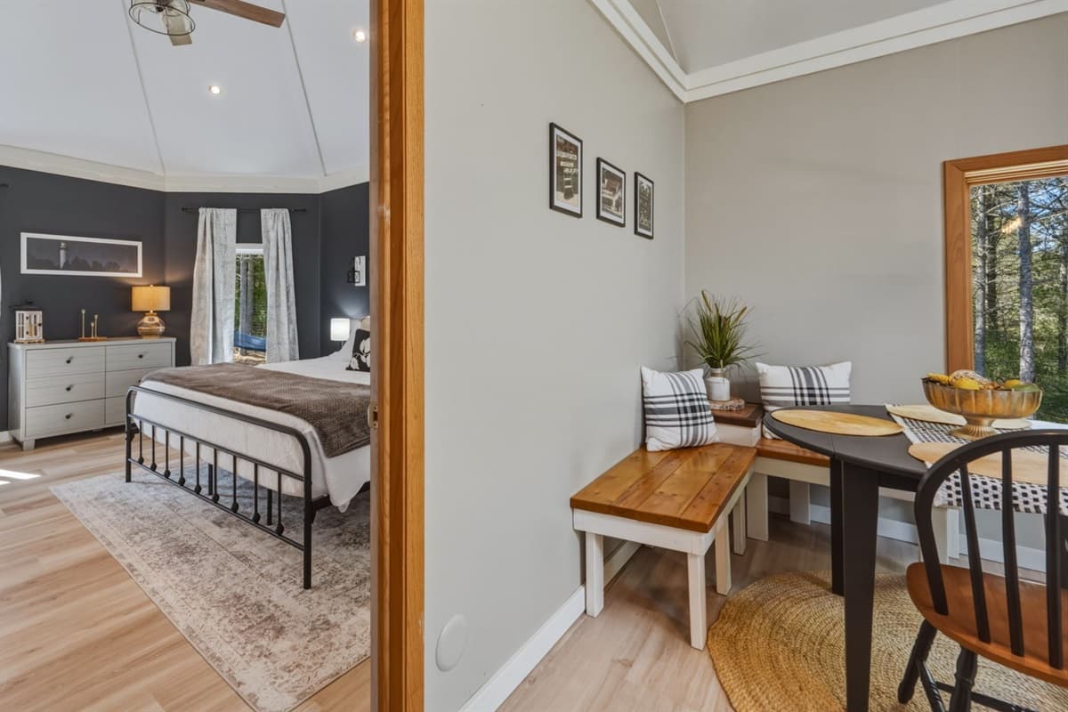 Spacious king bedroom designed for comfort and relaxation, featuring a plush king-size bed, soft linens, and a calming atmosphere perfect for unwinding after a day exploring Door County.