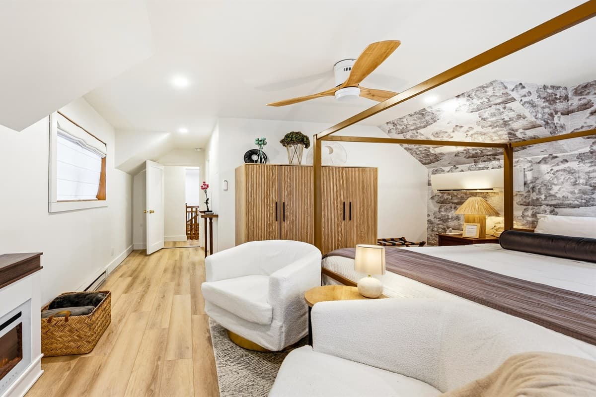 The upstairs Master Bedroom offers a plush king bed, creating a serene retreat.