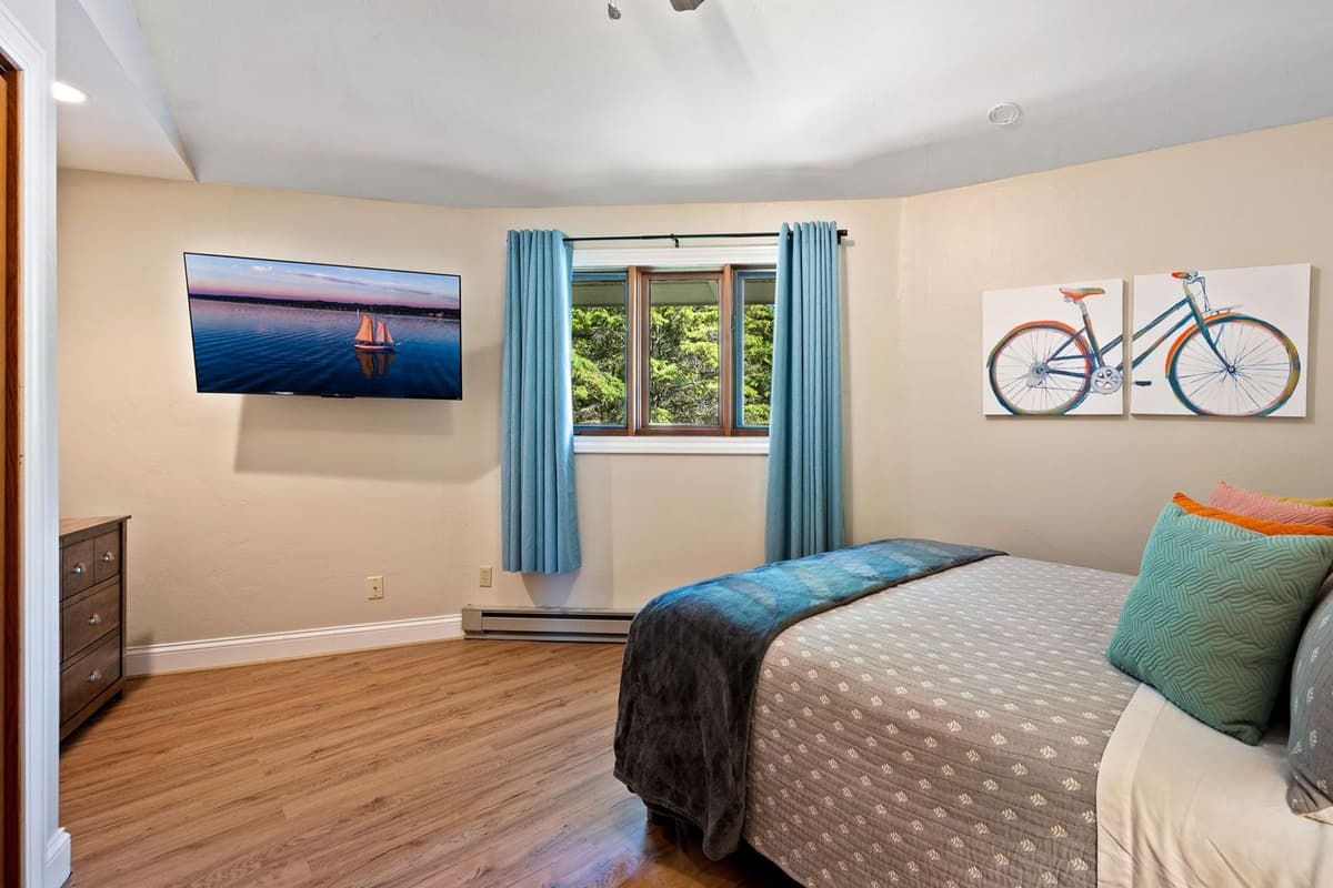 Unwind in the comfortable queen bedroom, a peaceful space to relax at the end of the day.