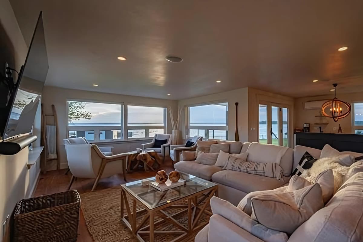 The living room features a comfortable sofa where you can kick back and relax. Settle in with a good book, watch your favorite show, or gather with family and friends for a cozy evening together.
