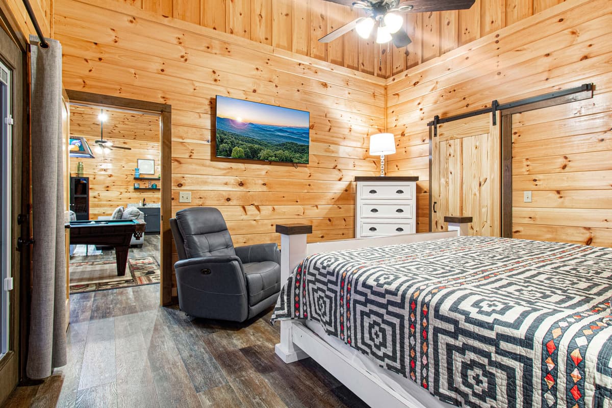 Located upstairs for added privacy, this inviting bedroom provides a comfortable place to unwind and enjoy a restful night’s sleep.