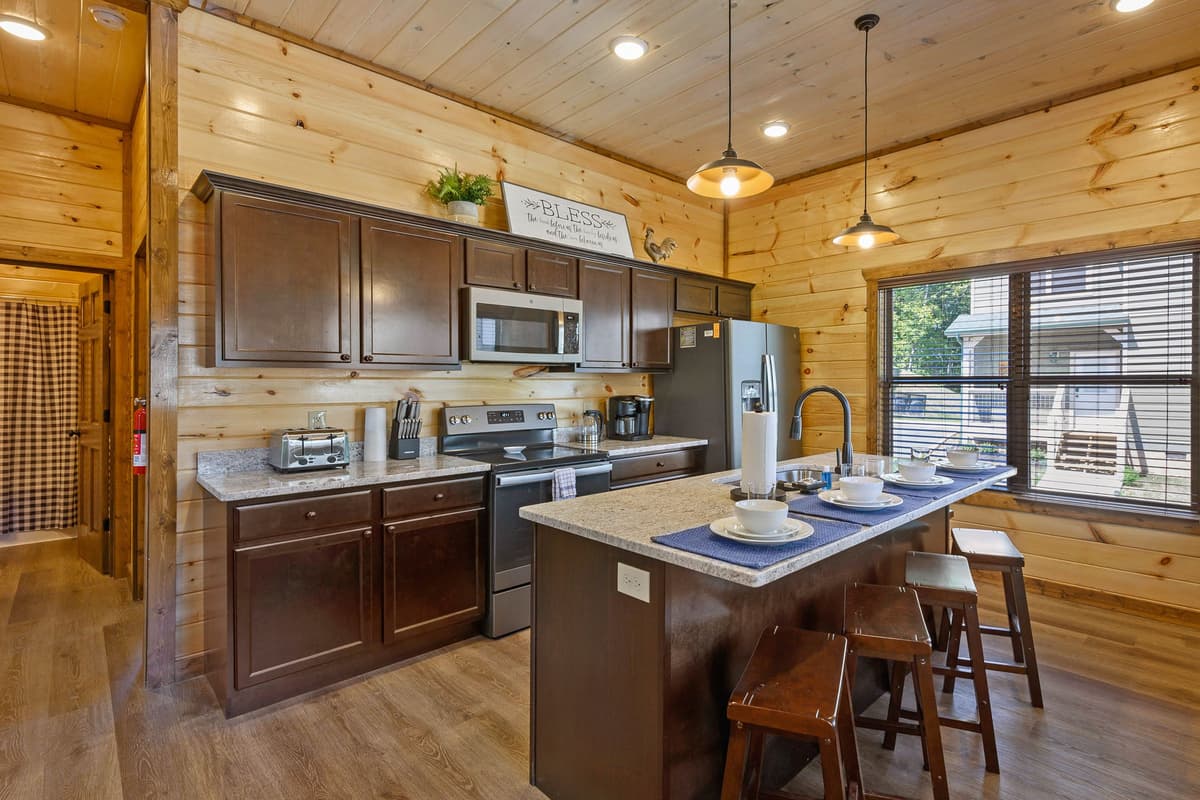 Gather around the spacious kitchen island and enjoy a casual dining experience right at the heart of the cabin.