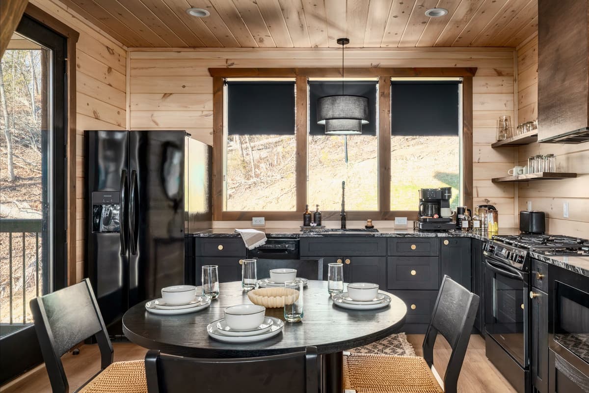 Its convenient location beside the kitchen makes mealtime easy while keeping the entire group connected.