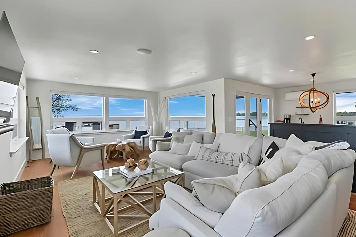 The spacious living room features a comfortable sofa and plenty of room to relax and unwind.