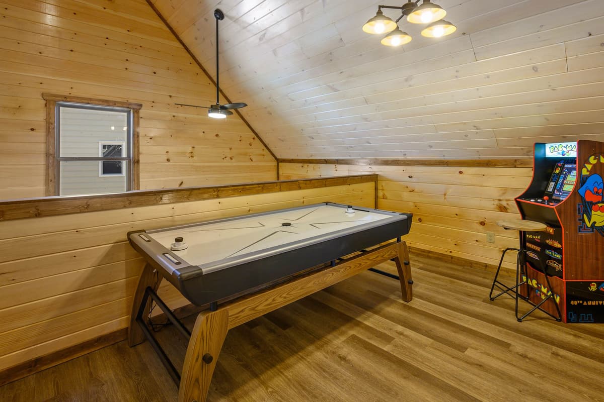 Take the fun upstairs to the cabin’s exciting game room! Challenge your crew to a fast-paced game of air hockey or the classic Pacman arcade game.