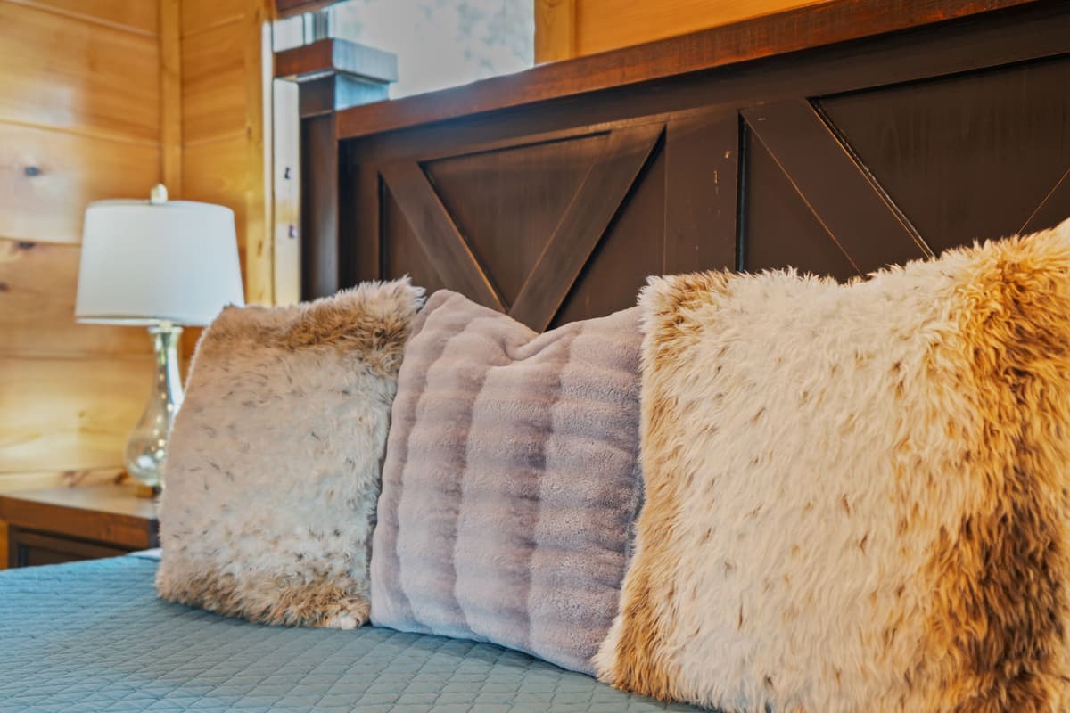 Warm rustic touches create a peaceful cabin atmosphere that feels both charming and inviting.