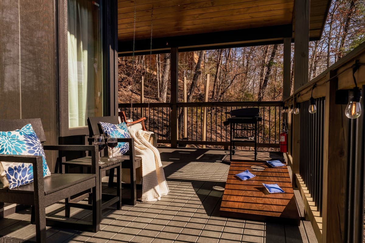 Step outside and enjoy the fresh mountain air from the inviting porch, complete with comfortable seating where you can sip your morning coffee, relax with a good conversation, or simply take in the peaceful surroundings.