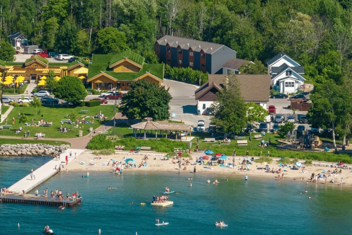 Relax and unwind at Sister Bay Beach, where clear waters, sandy shores, and stunning sunsets make for a perfect Door County retreat!
